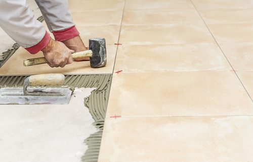 Install new tile floors in Rental House