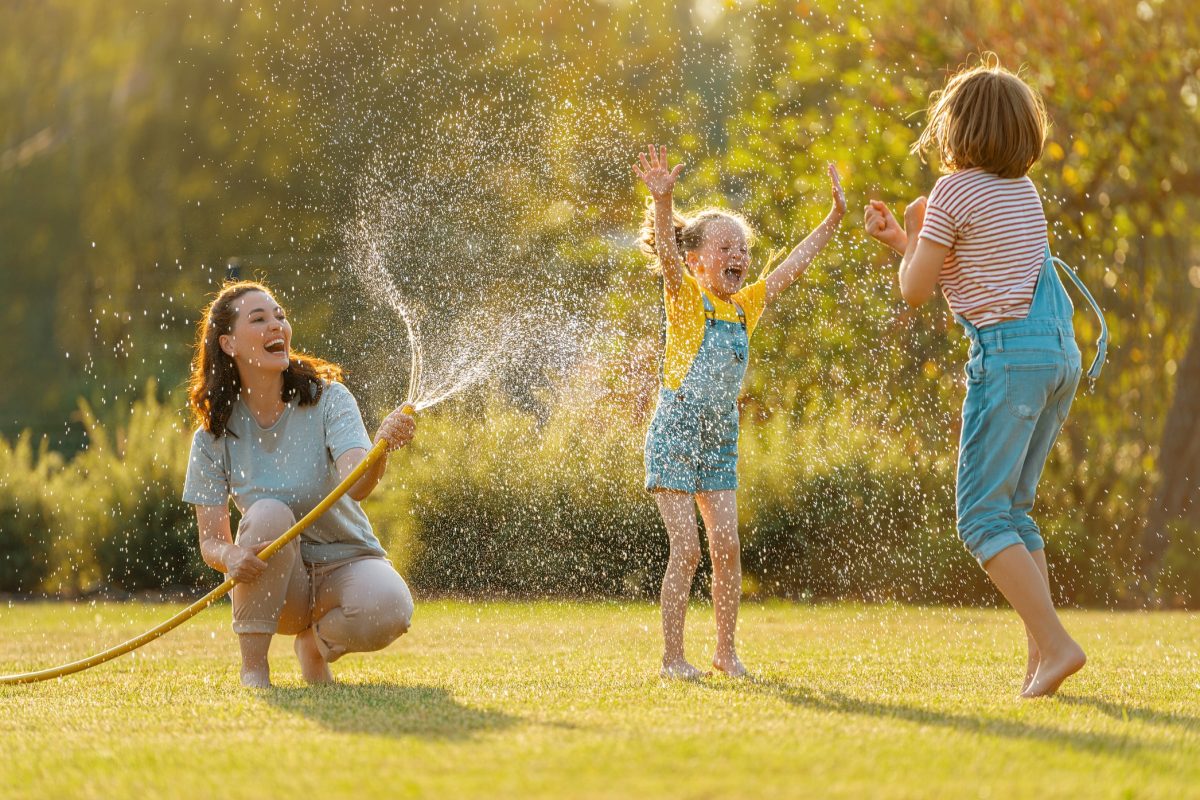 Happy family playing in backyard